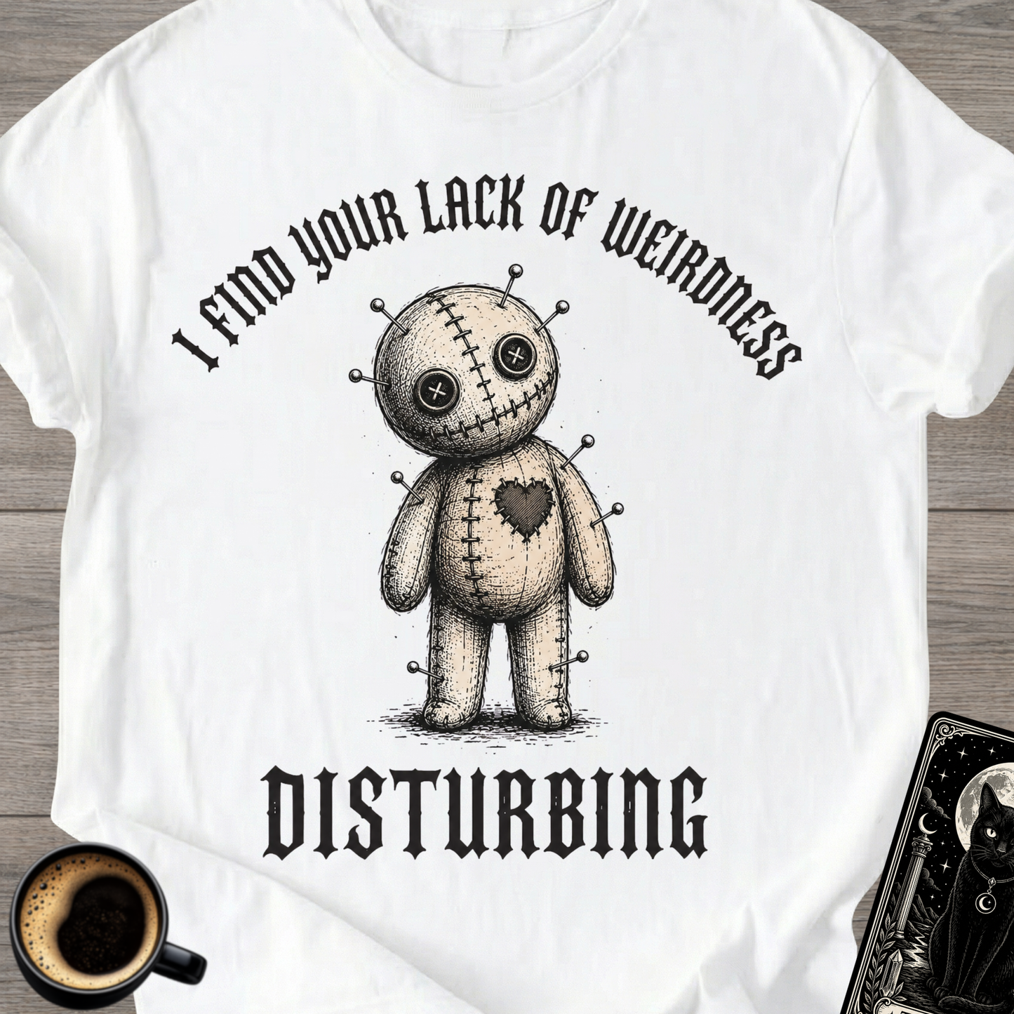 Lack Of Weirdness Voodoo Doll T‑Shirt