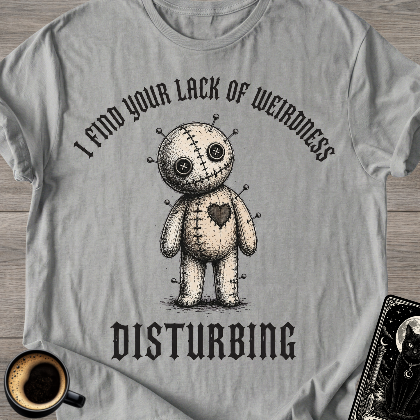Lack Of Weirdness Voodoo Doll T‑Shirt